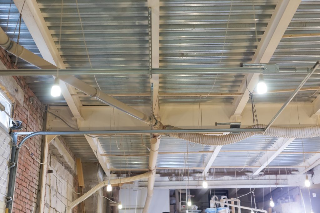 indoors and workshop concept - ceiling of the workshop at the factory